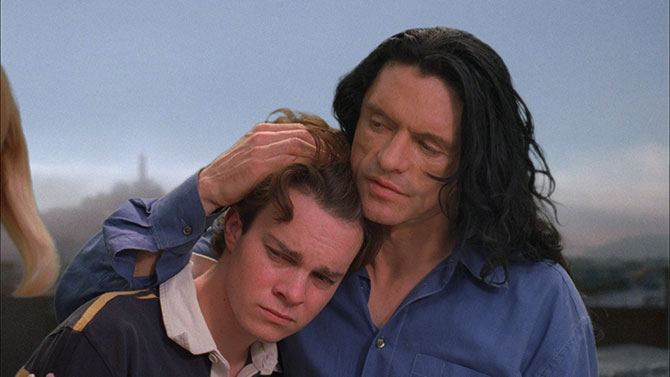 Johnny (Tommy Wiseau) gives Denny (Philip Haldiman) some neighbourly advice